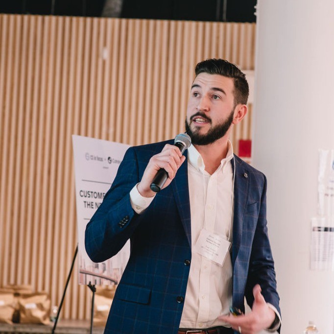 Ryan Bullard speaking at a customer success event